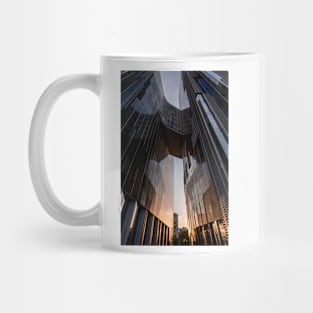 Sunset reflection on mirror building Mug